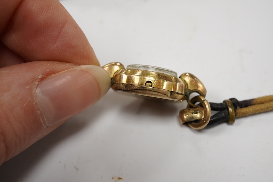 A lady's steel and gold plated Omega manual wind wrist watch, on an associated leather strap, together with a lady rolled gold Bucherer wrist watch. Condition - poor